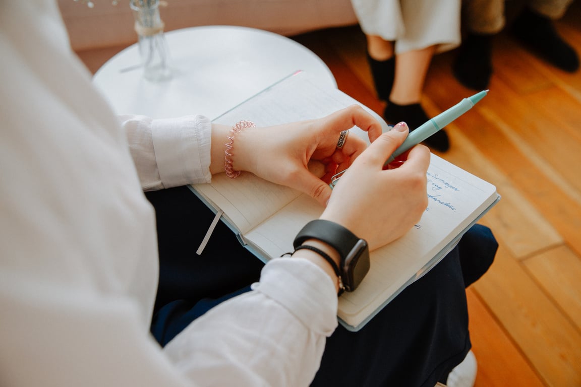 Close Up of Therapist Holding Notebook